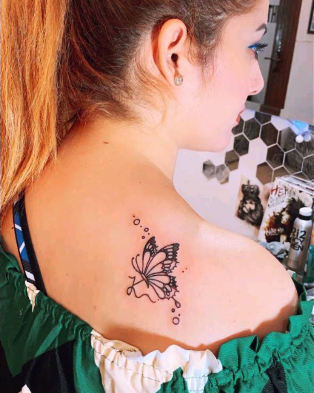 Ilsa Khan with butterfly shoulder tattoo